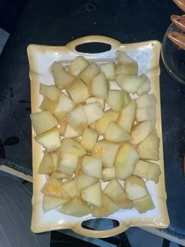 Slices of melon in a tray. Stock Photos