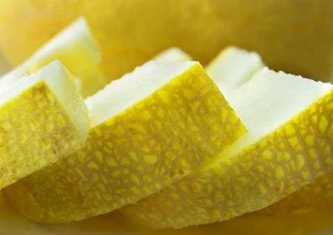 Slices of melons closeup Stock Photos