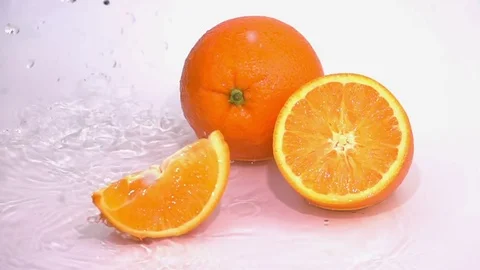 Slices of Orange are Falling on the Table. Video stock 74519851