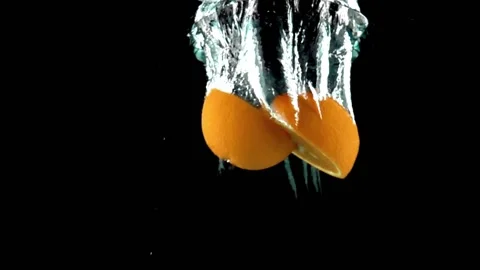 Slices Of Orange Float Separately In The Water Vidéo 138551355