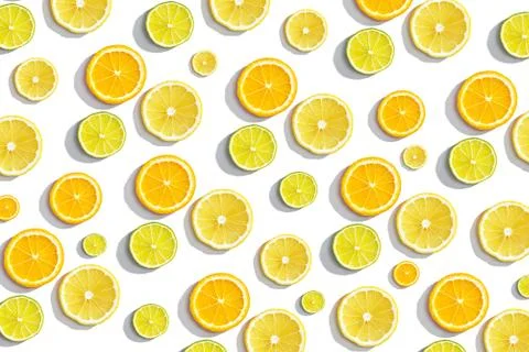 Slices oranges, lime on white background, summer citrus background Stock Photos