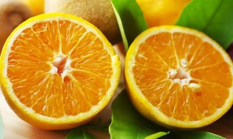 Slices of oranges  on table Stock Photos