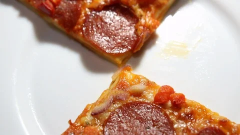 Slices of pepperoni pizza on the plate Stock Footage 111068970