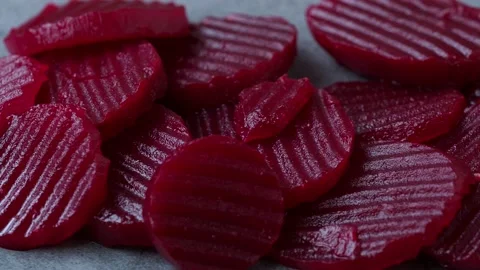 Slices of pickled red beets on black background Stock Footage 239610833