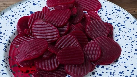 Slices of pickled red beets on a plate Stock Footage 239610764