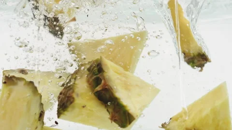 Slices of Pineapple Falling into Water Stock Footage 171921942