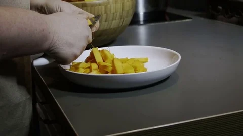 Slices of pumpkin lie in a plate Stock Footage 76982085