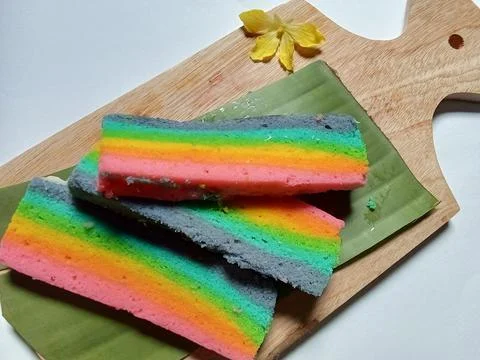 Slices of rainbow cake Foto stock