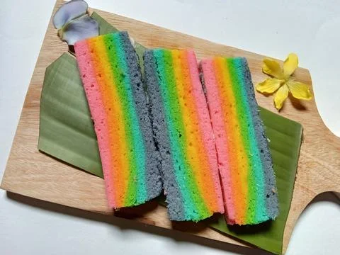 Slices of rainbow cake Фото