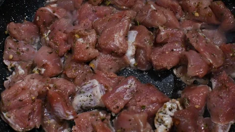 Slices of raw pork on a pan Stock Footage 119918512