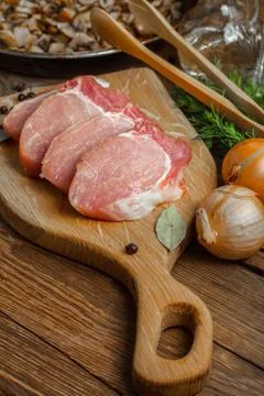 Slices of raw pork. Stock Photos