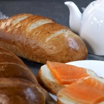 Slices of red fish on a slice of buttered bread Stock Photos
