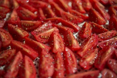 Slices of red tomatoes for drying Stock Photos