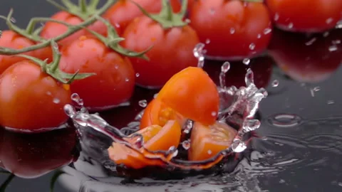Slices of Ripe Tomato Falls on the Table Stock Footage 119422222