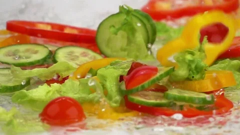 Slices of Ripe Vegetables are Falling on the Table. Stock Footage 79530652