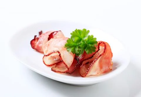 Slices of roast bacon Stock Photos