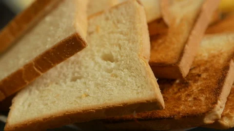 Slices of roasted bread close-up Stock Footage 134266398