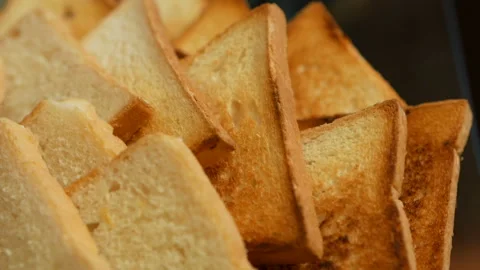 Slices of roasted bread close-up Stock Footage 134267253