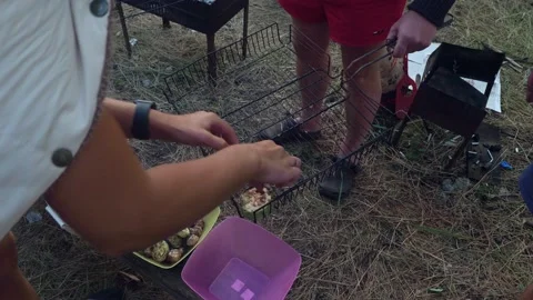 Slices of roasted squash are put into a bowl. Meals during a picnic Stock Footage 145093054