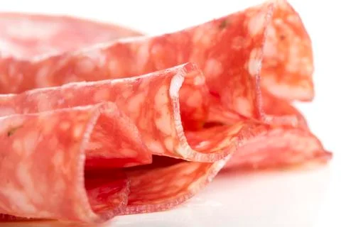 Slices of rolled salami Stock Photos