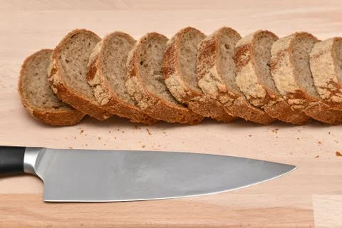 Slices of rye bread and kitchen knife on kitchen plank 000012602 스톡 사진