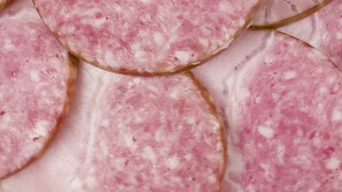 Slices of salami  background. Video stock 151511607