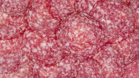 Slices of salami  background. Video stock 151511620