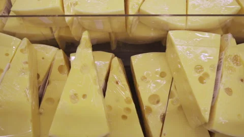 Slices of sliced cheese in the store Stock Footage 194482638