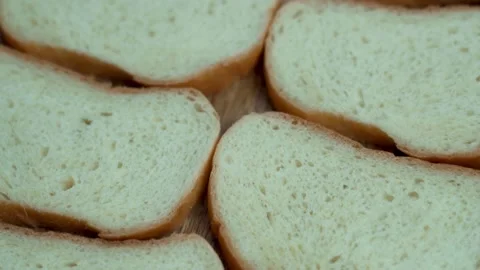 Slices of Sliced Fresh White Bread on the Breakfast Table, Macro, Rotation, Top  Stock Footage 145394771