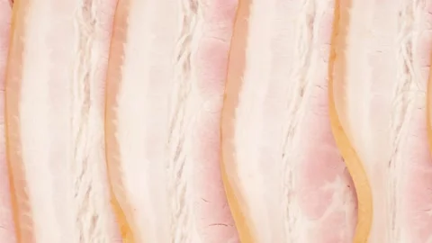 Slices of smoked ham - background. Stock Footage 140974847