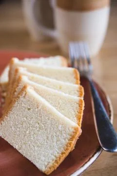Slices of sponge cake with tea Stock Photos