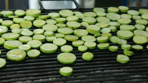 Slices of squash roasting on grill 库存影片 96641979