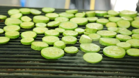 Slices of squash roasting on grill Stock Footage 96642425