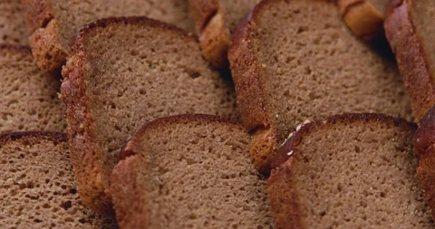 Slices of stacked brown bread Stock Footage 95551326