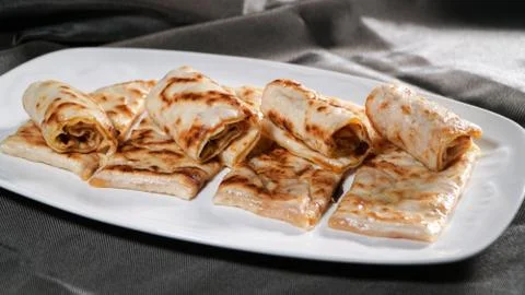 Slices of thin dough stuffed with pumpkin Stock Photos