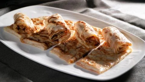 Slices of thin dough stuffed with pumpkin Stock Photos