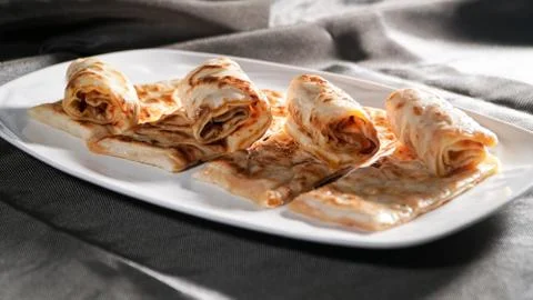Slices of thin dough stuffed with pumpkin Stock Photos
