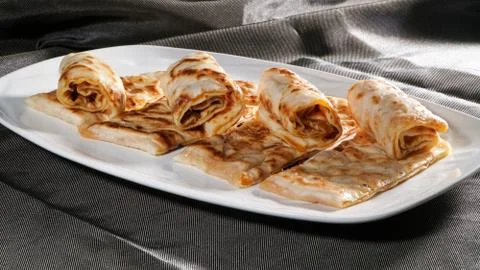 Slices of thin dough stuffed with pumpkin Stock Photos