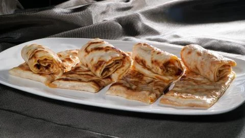 Slices of thin dough stuffed with pumpkin Stock Photos