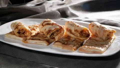 Slices of thin dough stuffed with pumpkin Stock Photos