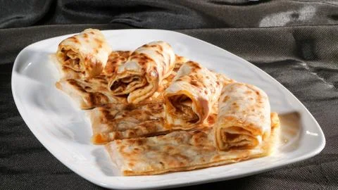 Slices of thin dough stuffed with pumpkin Stock Photos