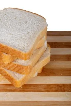 Slices of Toast Bread on Breadboard Stock Photos