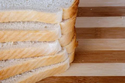 Slices of Toast Bread on Breadboard Stock Photos