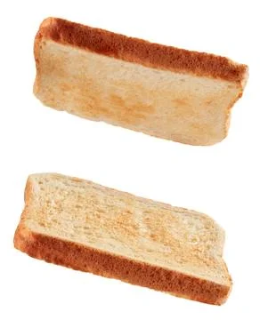 Slices of toasted bread flying isolated on white Foto stock
