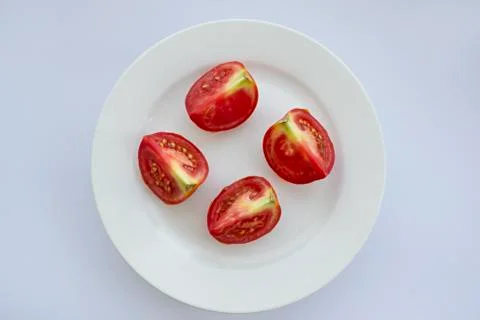Slices of tomato on white background Stock Photos