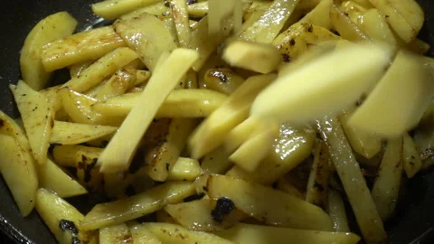 Slices of uncooked sliced potatoes fall in slow motion. Stock Footage 130840672