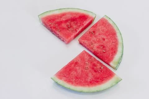 Slices of watermelon on a white background, top view Stock Photos