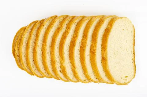 Slices of wheat bread isolated on white background. Studio Photo. Stock Photos