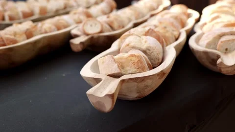 Slices of Wheat Bread Lying on Wood at a Dinner Buffet Stock Footage 321647550