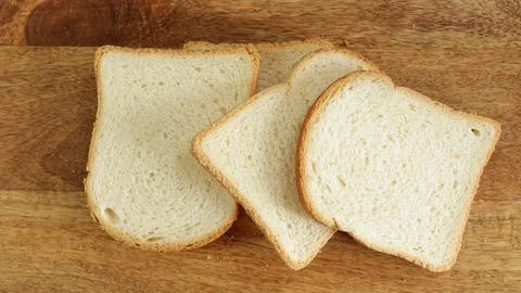 Slices of white bread, close-up, on a table Foto stock